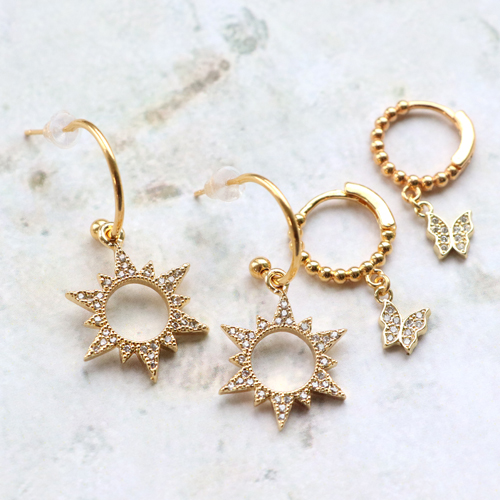 Trendy oorbellen en armbanden met zirkonia bedels en tussenstukken: