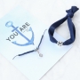 Armbanden en ringen met ankers in blauwe tinten