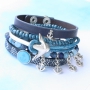 Armbanden en ringen met ankers in blauwe tinten
