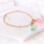 Vrolijke enkelbandjes, armbandjes en zonnebrilkoord met kwastjes voor de zomer