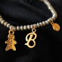 Tips om je top facet armbandjes te versieren met DQ metalen bedels: