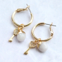 Trendy oorbellen en armbanden met zirkonia bedels en tussenstukken: