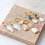 Ontwerp sieraden met een zomerse look met nieuwe schelp bedels 