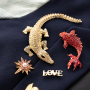 Mix & match met statement broches